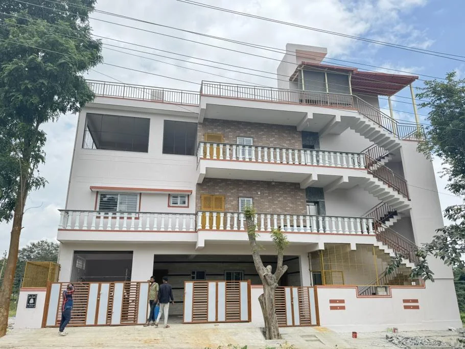 Completed G+2 modern white residence at Nandanavana Layout